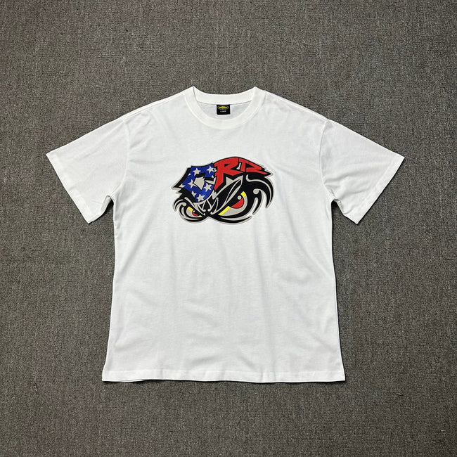 Corteiz Eagle Eye Graphic White T-Shirt — Patriotic Streetwear Tee with Bold Motorcycle Print Hover Image